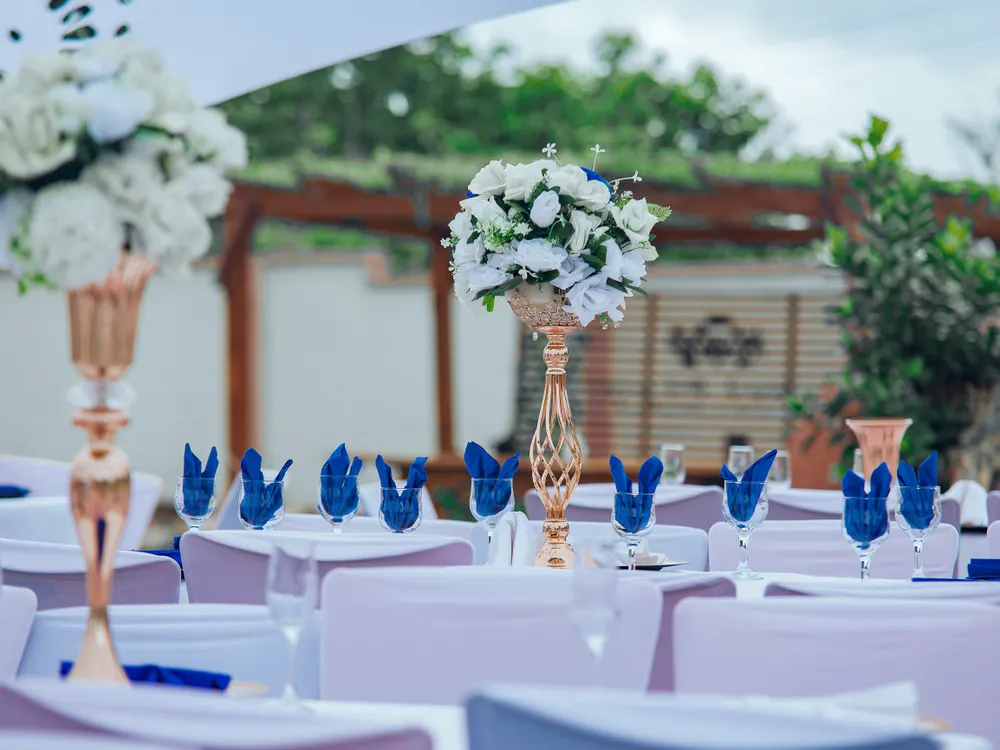 Waterfront wedding dinner table under open sky